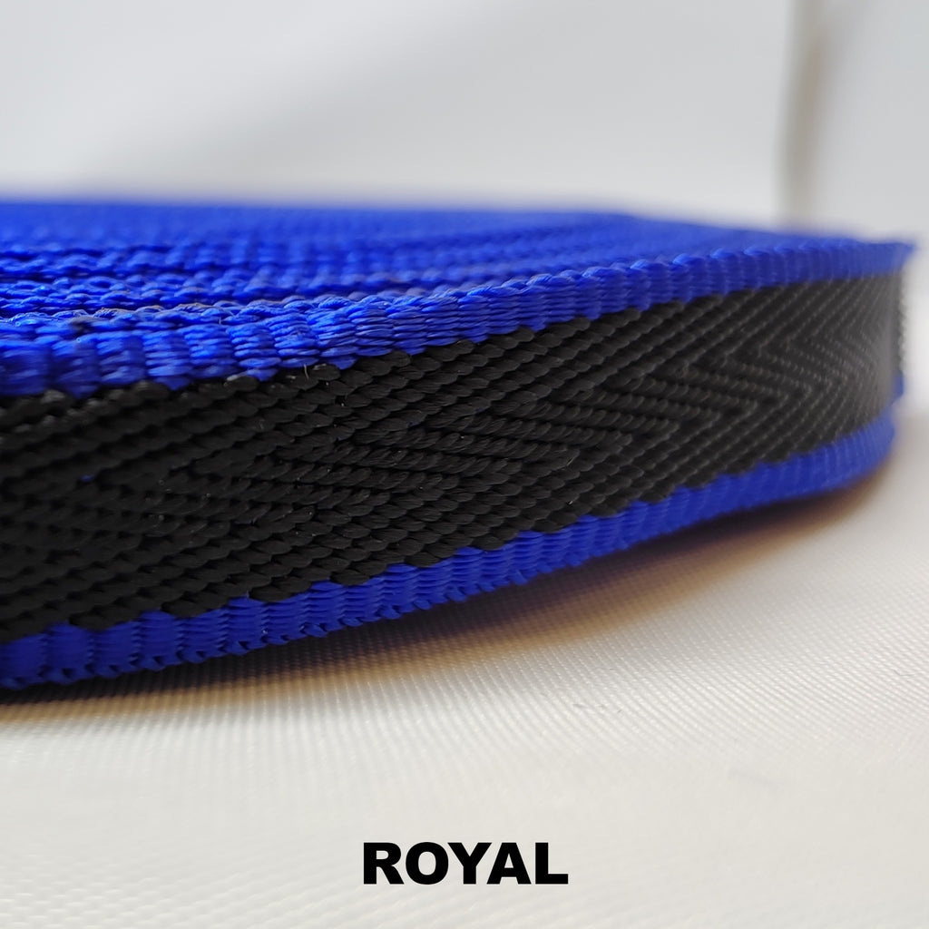 Roll of royal blue herringbone webbing with single thick black stripe running down the centre