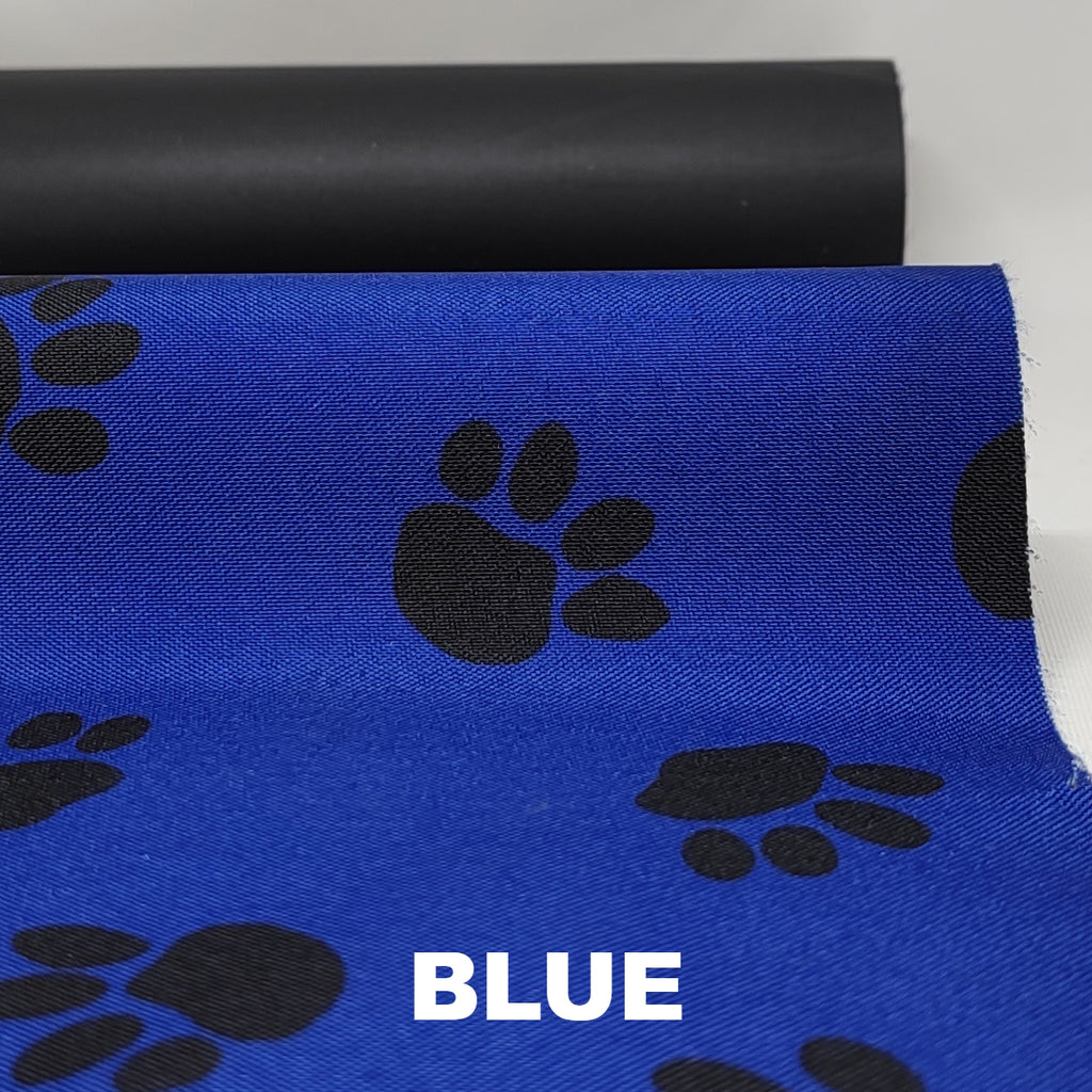 Royal blue waterproof polyester with black pawprint pattern and black underside
