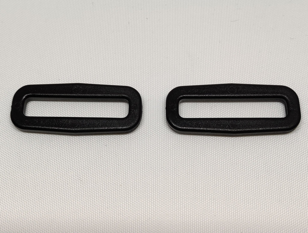 Two black plastic 40 millimetre square rings