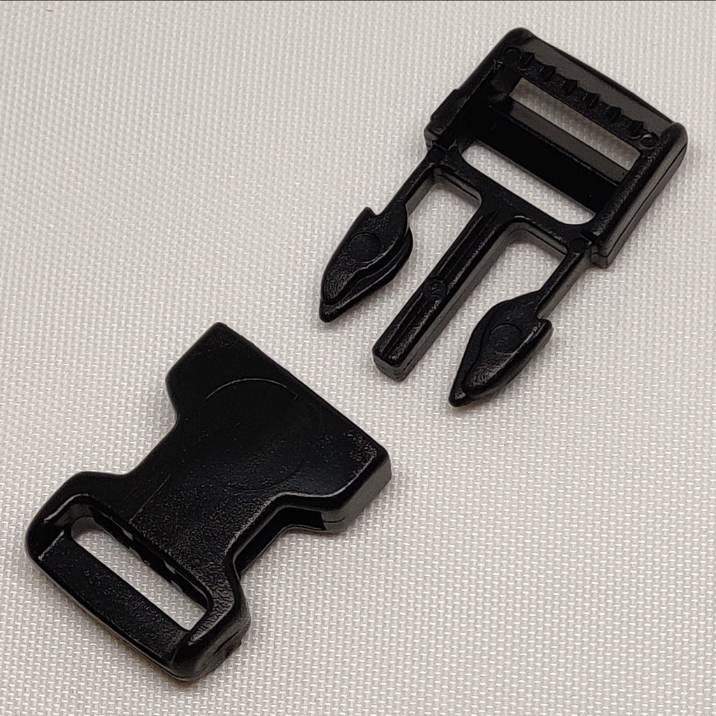 Black plastic 15 millimetre side release buckle, shown disconnected