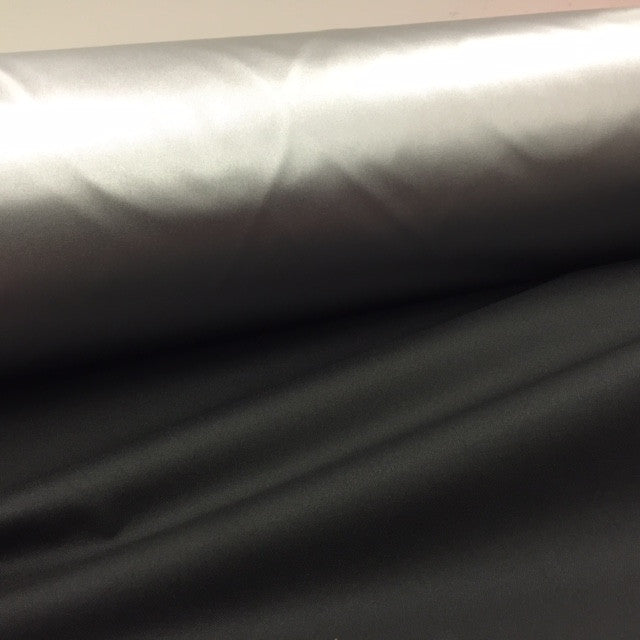 Silver reflective polyester with black underside