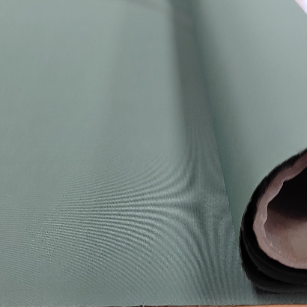 Roll of olive green lycra fabric