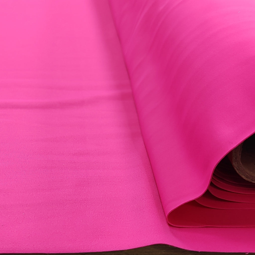 Roll of pink lycra fabric