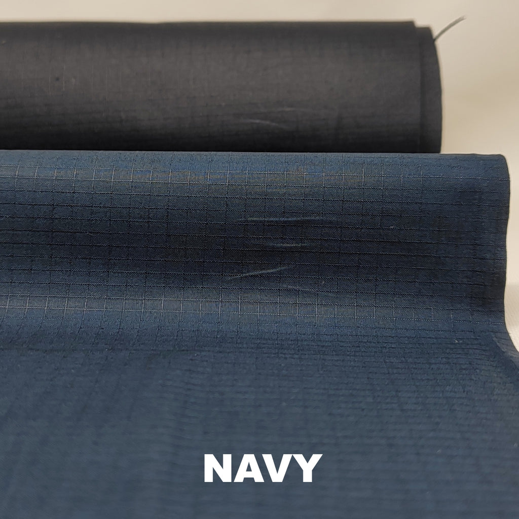 Navy dry wax cotton riptstop fabric by British Millerain
