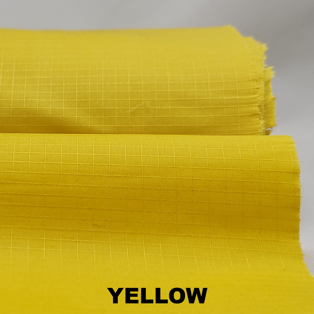 Yellow dry wax cotton riptstop fabric by British Millerain