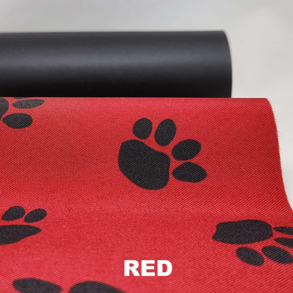Red waterproof polyester with black pawprint pattern and black underside