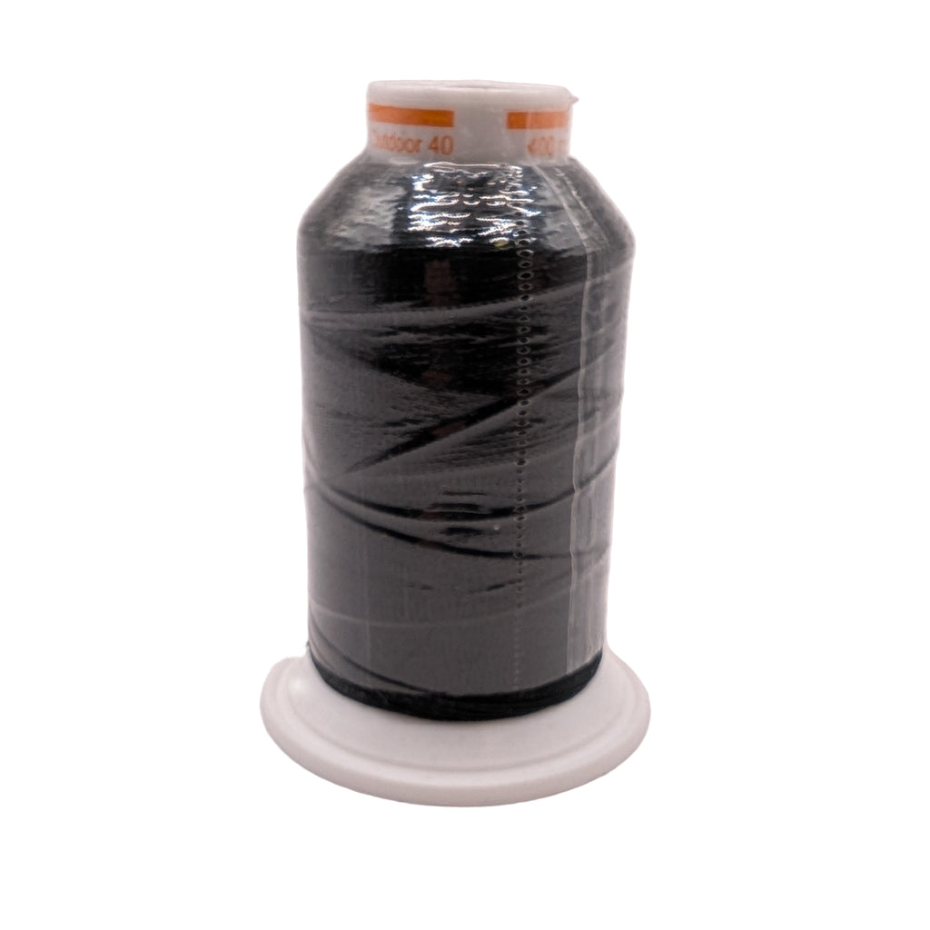 Spool of black outdoor thread on a white background