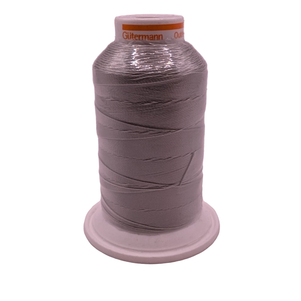 Spool of silver outdoor 40 thread on a white background