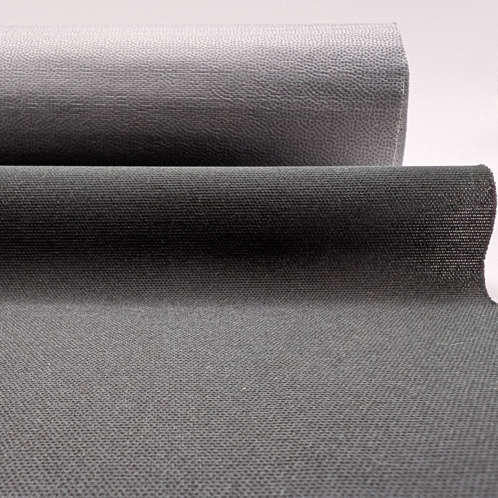 Roll of black breathable stretch fabric on white background