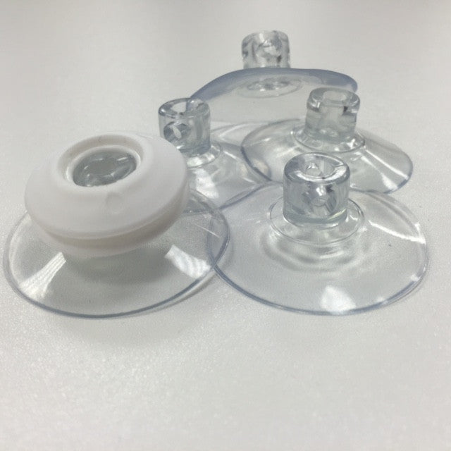 Transparent suction pads shown with white plastic eyelet