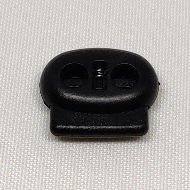 Black plastic twin hole flat cord lock
