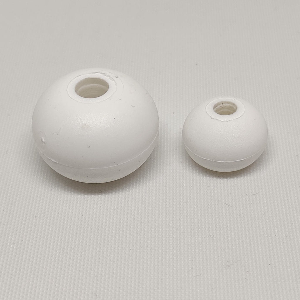 White plastic ropestoppers, left 6 millimetres, right 4 millimetres
