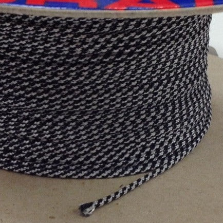 Roll of black and white strong dyneema cord in 1.5 millimetres