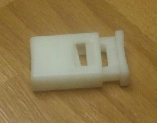 White plastic rectangular spring push cord lock